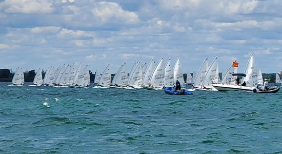 ILCA sailors at the starting line in Cork, 2023, sharpening skills with SailFit training.